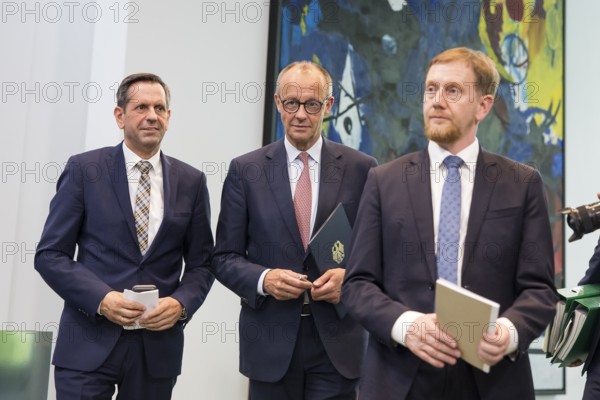 Olaf Lies (SPD, Minister President of Lower Saxony), Friedrich Merz (CDU, Federal Chancellor) and Michael Kretschmer (CDU, Minister President of the Free State of Saxony) after a press conference on the consultation between Federal Chancellor Friedrich Merz and the heads of government of the federal states at the Federal Chancellery, Berlin, 18 June 2025