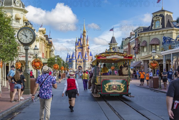 Horse pulling trolley car with Disney characters down Main Street in the Magic Kingdom at Walt Disney World, Orlando, Florida