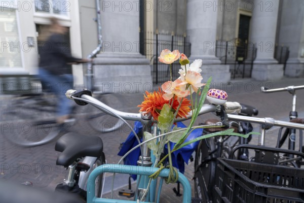 Cycling in the Netherlands, Utrecht, parked bike with flower decoration on the handlebars