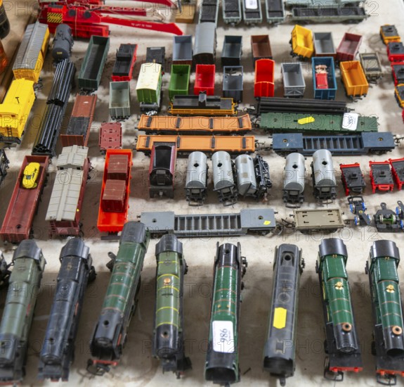 Model railway toy train set items on display for sale at auction room, UK