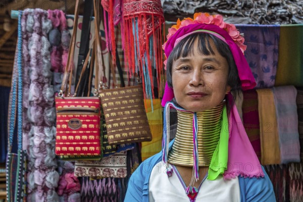 Tribal woman selling woven scarves and other crafts in the Long Neck Karen tribe (more properly called the Kayah Lahwi tribe) area of the Union of Hill Tribe Villages outside of Chiang Rai in the Nanglae District of Thailand