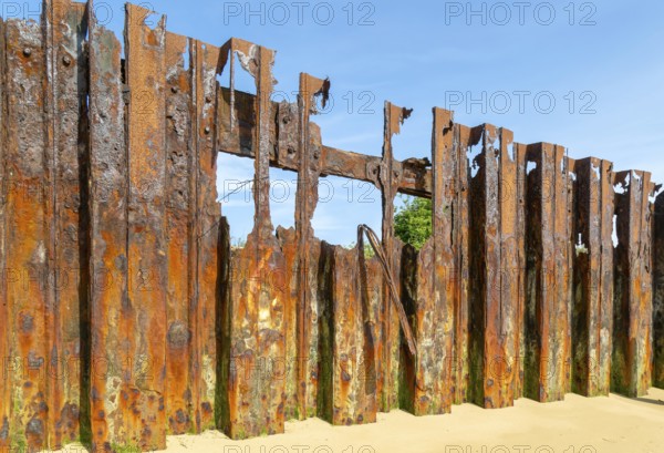 Old rusty broken steel sheet piling sea wall coastal defence, River Deben, Bawdsey, Suffolk, England, UK