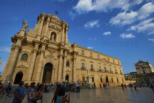 Cathedral of Syracuse, shot of the baroque cathedral from a distance with a busy square under a clear sky, Ortigia Island, Isola di Ortigia, Historic Centre, Syracuse, Sicily, Italy, Europe