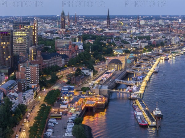 Aerial view of the jetties in the harbour at blue hour with churches in the background, Hamburg, Germany, Europe