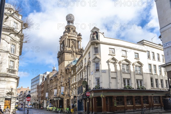 City street view featuring the london coliseum, a historic theatre located in st. Martin's lane, showcasing traditional english architecture