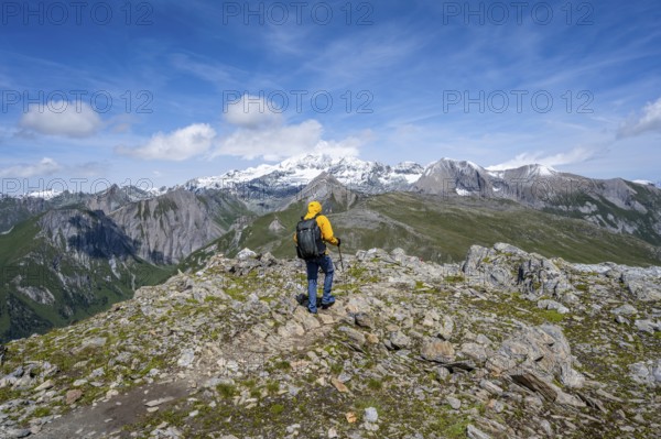 Mountaineers on a hiking trail, view of picturesque mountain landscape with snow-covered summit of the Großglockner, Vienna High Trail, Schober Group, Hohe Tauern National Park, Carinthia, Austria, Europe