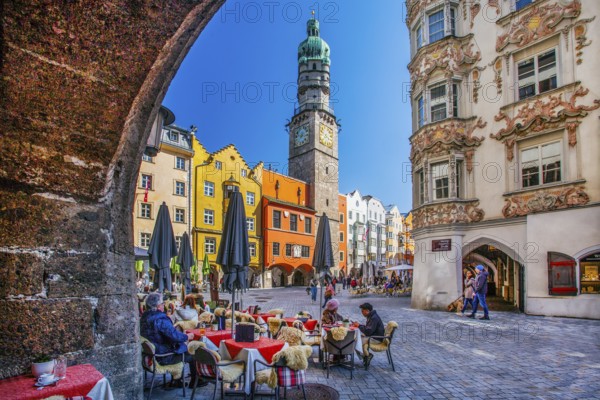 Street café on Herzog-Friedrich-Strasse with the Helblinghaus and city tower in the old town, Innsbruck, Inntal, Tyrolean Alps, Tyrol, Austria, Europe