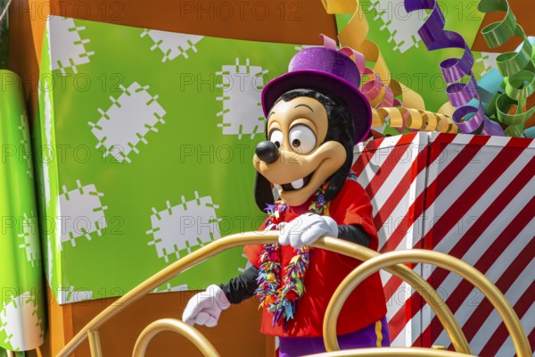 Disney character riding on float during parade through the Frontierland area of Magic Kingdom at Walt Disney World, Orlando, Florida