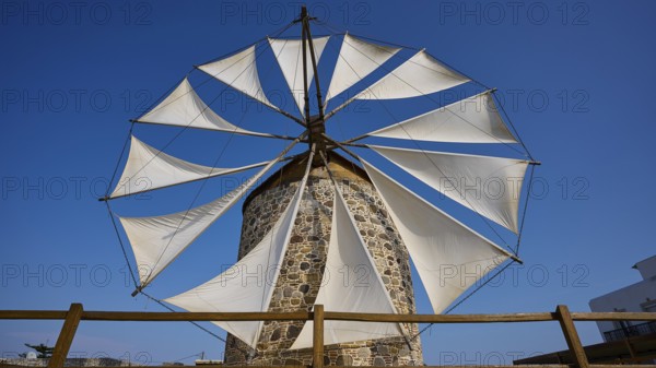 Large sails of a windmill over a wooden fence, Windmill, Antimacheia, Kos, Dodecanese, Greek Islands, Greece, Europe