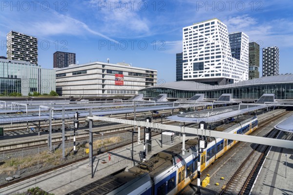Utrecht Centraal railway station, tracks and concourse, trains of Nederlandse Spoorwegen N.V. state railway company, office building in the city centre, Netherlands