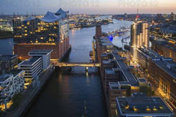 Aerial view of the Elbphilharmonie at blue hour with harbour and Elbe in the background, Hamburg, Germany, Europe