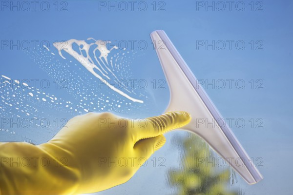 Glass cleaning: Close-up of a window pane being cleaned