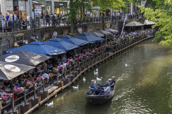 The old town centre of Utrecht, Oudegracht, around 2 km long with many old houses, shops, restaurants directly on the canal, many bridges, boat traffic of all kinds, Netherlands