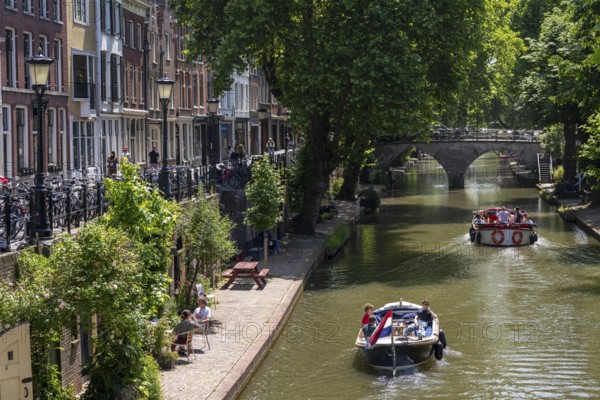 The old town centre of Utrecht, Oudegracht, around 2 km long with many old houses, shops, restaurants directly on the canal, many bridges, boat traffic of all kinds, Netherlands