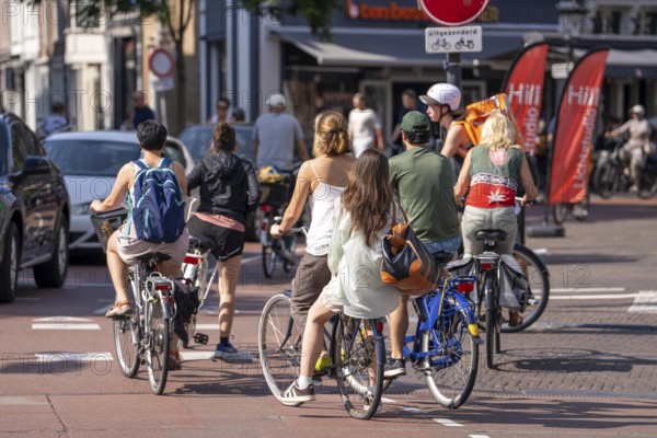Cycling in the Netherlands, Utrecht, typical riding style with 2 people on one bike