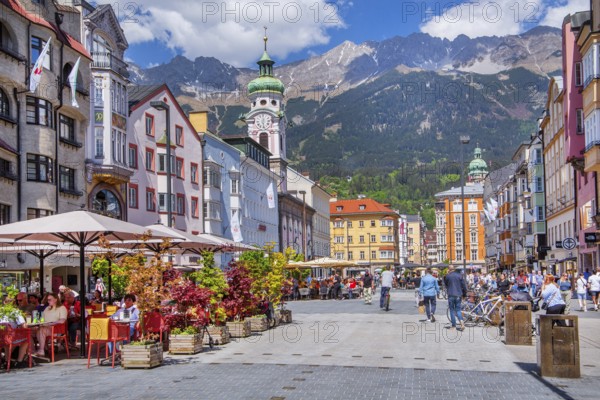 Street café on the pedestrian zone Maria-Theresien-Strasse in front of the Nordkette of the Karwendel Mountains, Innsbruck, Inntal, Tyrolean Alps, Tyrol, Austria, Europe