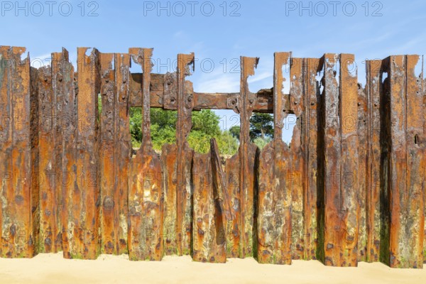 Old rusty broken steel sheet piling sea wall coastal defence, River Deben, Bawdsey, Suffolk, England, UK