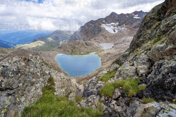 High mountain landscape, view of mountains and mountain lake Vogelhüttensee, Stubai Alps, South Tyrol, Italy, Europe