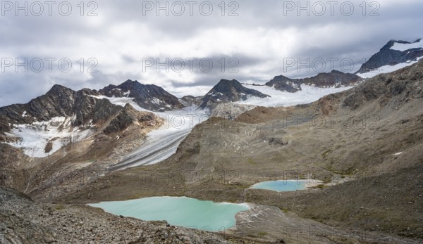 Glacial lakes in high mountain landscape with glacier tongue of the Übeltalferner, Stubai Alps, South Tyrol, Italy, Europe