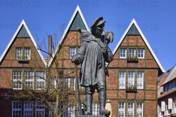Kiepenkerl monument, bronze sculpture, brick architecture, facade, window, blue cloudless sky, Spiekerhof, Münster, Münsterland, independent city, North Rhine-Westphalia, Germany, Europe