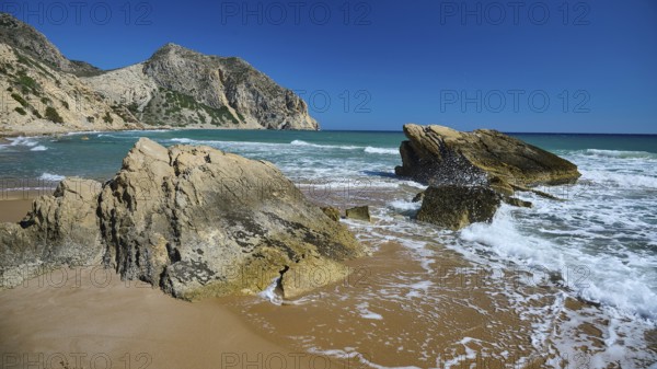 Beach, Kavo Paradiso, Paradise Beach, waves crashing against rocks on a sunny beach, Kefalos, Kos, Dodecanese, Greek Islands, Greece, Europe