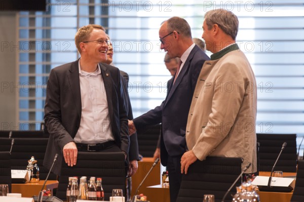 Daniel Günther (Minister-President of Schleswig-Holstein), Federal Chancellor Friedrich Merz (l, CDU) and Markus Söder (CSU Chairman and Minister-President of Bavaria) in front of the meeting between Federal Chancellor Friedrich Merz and the heads of government of the federal states in the International Conference Hall of the Federal Chancellery, Berlin, 18 June 2025