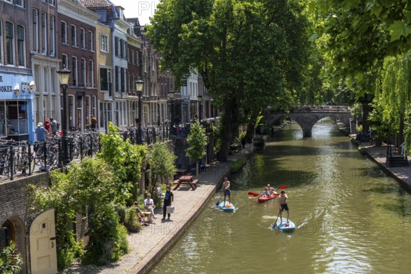 The old town centre of Utrecht, Oudegracht, around 2 km long with many old houses, shops, restaurants directly on the canal, many bridges, boat traffic of all kinds, Netherlands
