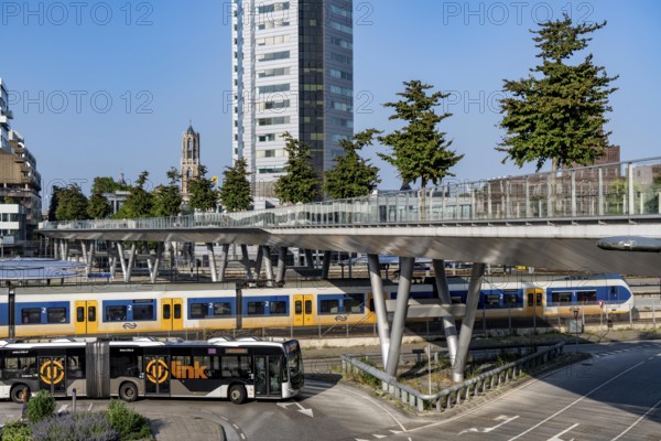 The Moreelsebrug, pedestrian and cycle bridge over the tracks of Utrecht Centraal, Central Station, Greened with trees, Netherlands