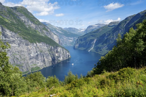 View of the idyllic fjord landscape of the Geirangerfjord at Blomberg Gård, near Geiranger, Møre og Romsdal, Norway, Europe