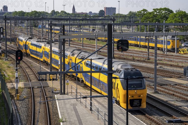 Rail transport in the Netherlands, Nederlandse Spoorwegen, Intercity train, double-decker IC VIRM, on the tracks in front of Utrecht Centraal station, Netherlands