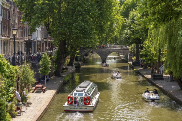 The old town centre of Utrecht, Oudegracht, around 2 km long with many old houses, shops, restaurants directly on the canal, many bridges, boat traffic of all kinds, canal cruise, Netherlands