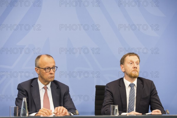 Federal Chancellor Merz (CDU, Federal Chancellor) and Michael Kretschmer (CDU, Minister-President of the Free State of Saxony) during a press conference after the consultation between Federal Chancellor Friedrich Merz and the heads of government of the federal states at the Federal Chancellery, Berlin, 18 June 2025