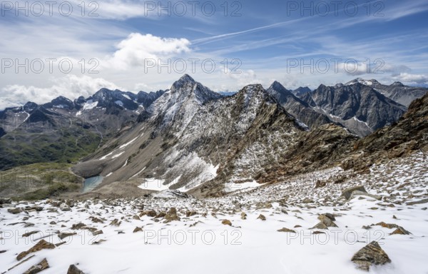View on the ascent to the Bösen Weibl, mountain landscape with fresh snow in summer, summit Roter Knopf and Kleiner Hornkopf at the back, Wiener Höhenweg, Schober group, Hohe Tauern National Park, Carinthia, Austria, Europe