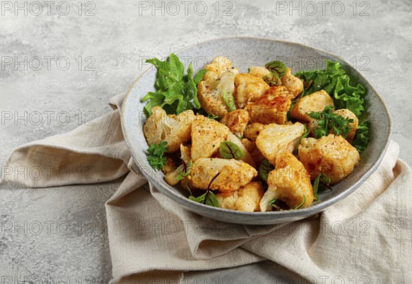 Fried cauliflower salad, with spices and herbs, homemade, no people