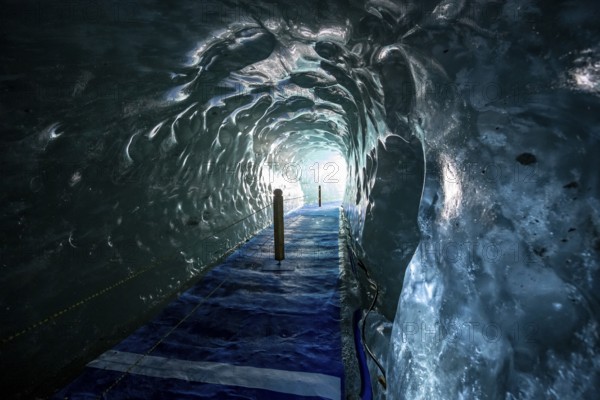 Artificial ice cave through the glacier ice, Mer de Glace, Montenvers, Chamonix, Haute-Savoie, France, Europe