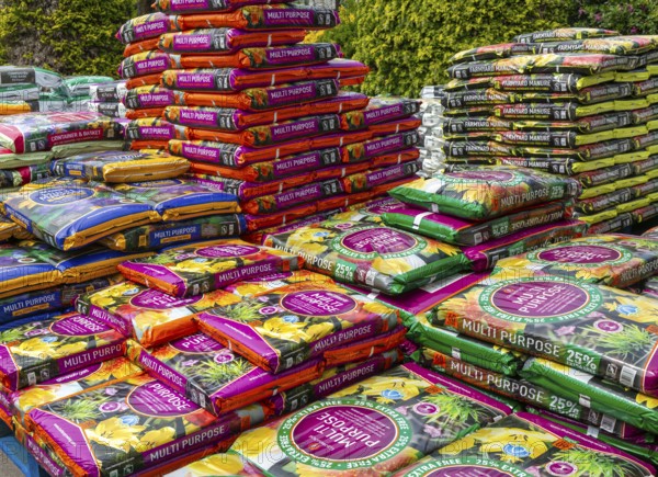 Multi Purpose compost bags stacked up at Lowden garden centre, Wiltshire, England, UK