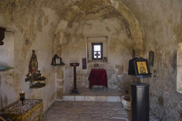 Small chapel interior with icons and religious decorations on the wall, Agios Nikolaos Chapel, Antimacheia, Medieval fortress, St John's Fortress, Antimachia, Kos, Dodecanese, Greek Islands, Greece, Europe