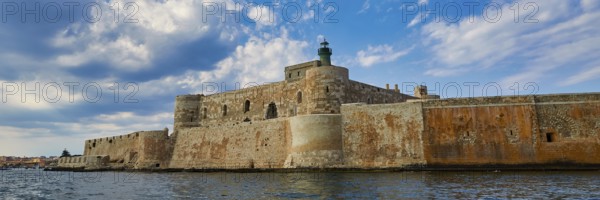 Castello Maniace, sea fortress Maniace, ancient fortress with lighthouse in front of a cloudy sky, boat trip around the island of Ortigia, Isola di Ortigia, Syracuse, Sicily, Italy, Europe