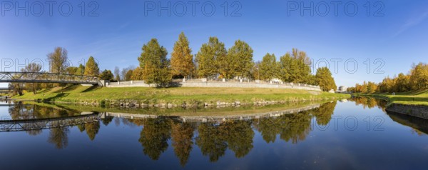 A picture of the Ostravice river and the foliage, in Ostrava, in the fall