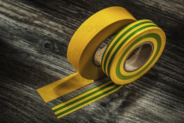 Yellow adhesive tape on wooden board