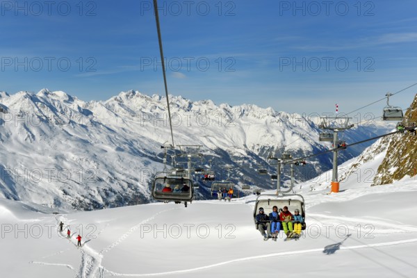 Skiers in chairlift Wurmkoglbahn, Obergurgl, Hochgurgl, Oetztal, Tyrol Ski Area, Austria, Europe