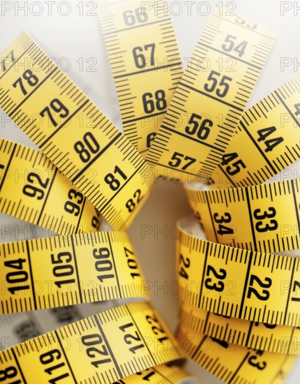 Yellow metric tape measure. Short depth-of-field