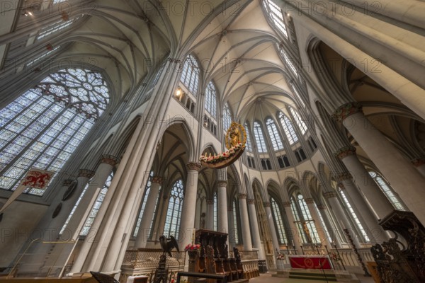 Altenberg Cathedral (also known as Bergischer Dom), interior view with grisaille windows in the choir apse, radiant-crowned Madonna (c. 1530) and eagle lectern, former monastery church of Altenberg Abbey, built by the Cistercians from 1133, since 1857 simultaneous church for the Protestant and Catholic churches, Odenthal, North Rhine-Westphalia, Germany, Europe