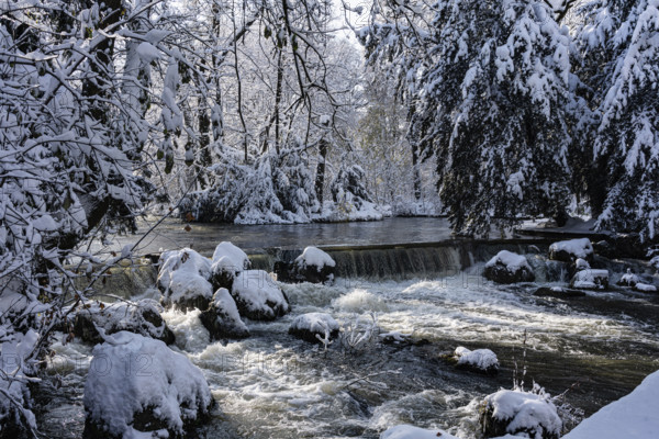 Waterfall at the Eisbach, winter with snow in the southern part of the English Garden, Munich, Bavaria, Germany, Europe