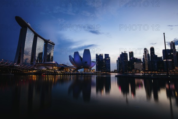 Marina Bay Sand area and Helix Bridge at dusk on a clear day on November 24th 2019