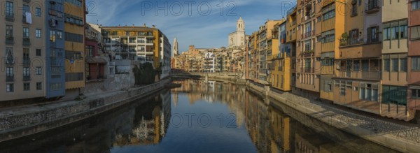 A panorama picture of Girona's Onyar river and its adjacent colorful buildings