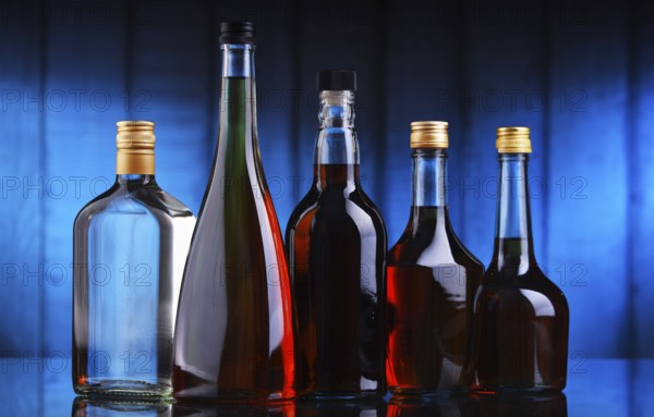 Composition with bottles of assorted alcoholic beverages