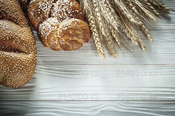 Loaf of bread Wheat ears on white board