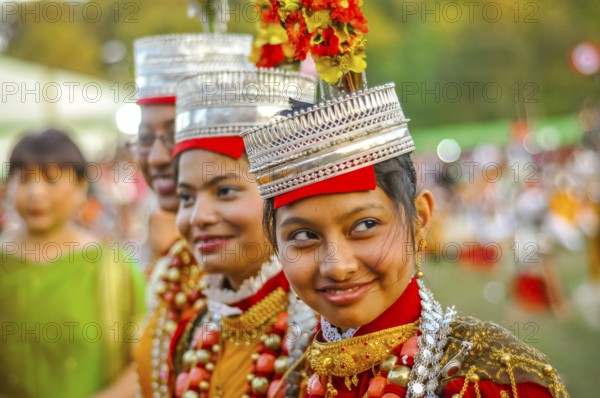 Shillong, Meghalaya, circa April 2012: Smiling girls in traditional costumes with large beads and crowns on their heads at Shad Suk Mynsiem Festival in Shillong, Meghalaya. Documentary editorial