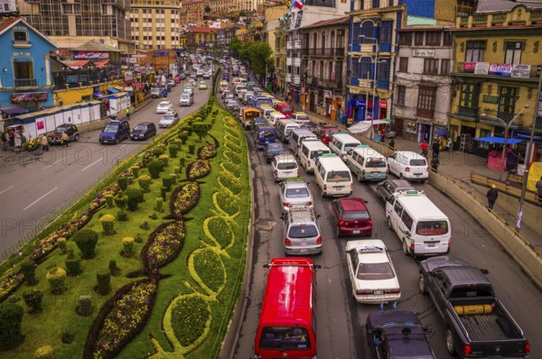 View from a bridge showing a street full of cars stuck in a traffic jam on the city highway in rush hour, La Paz, BOLIVIA in October 2015